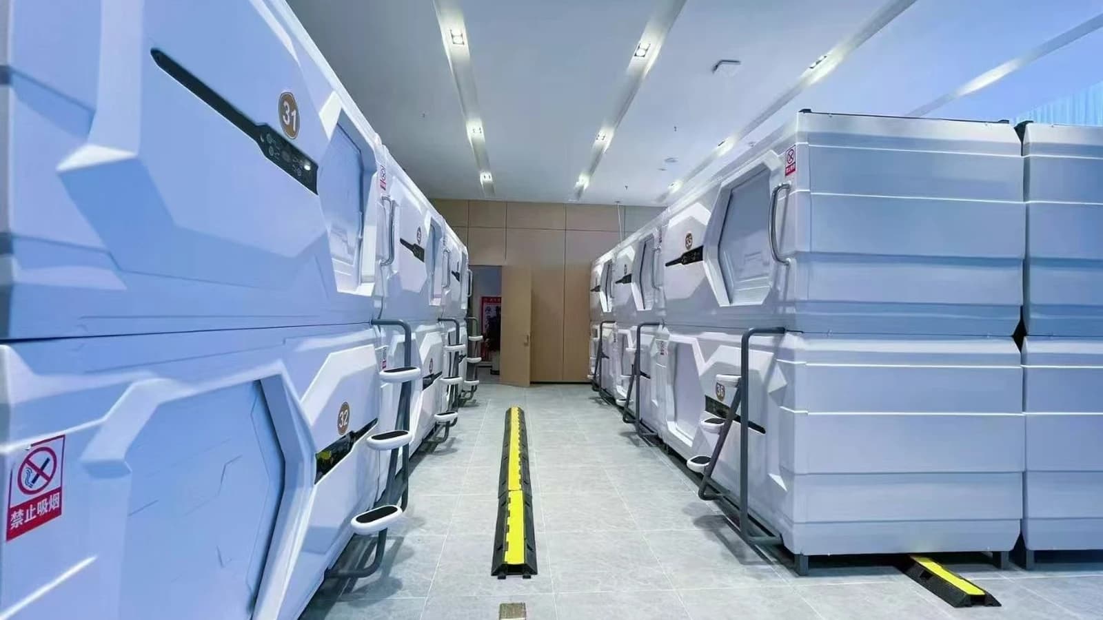 Installed GEELYE sleep pod rows illustrating lighting, finish and interior integration