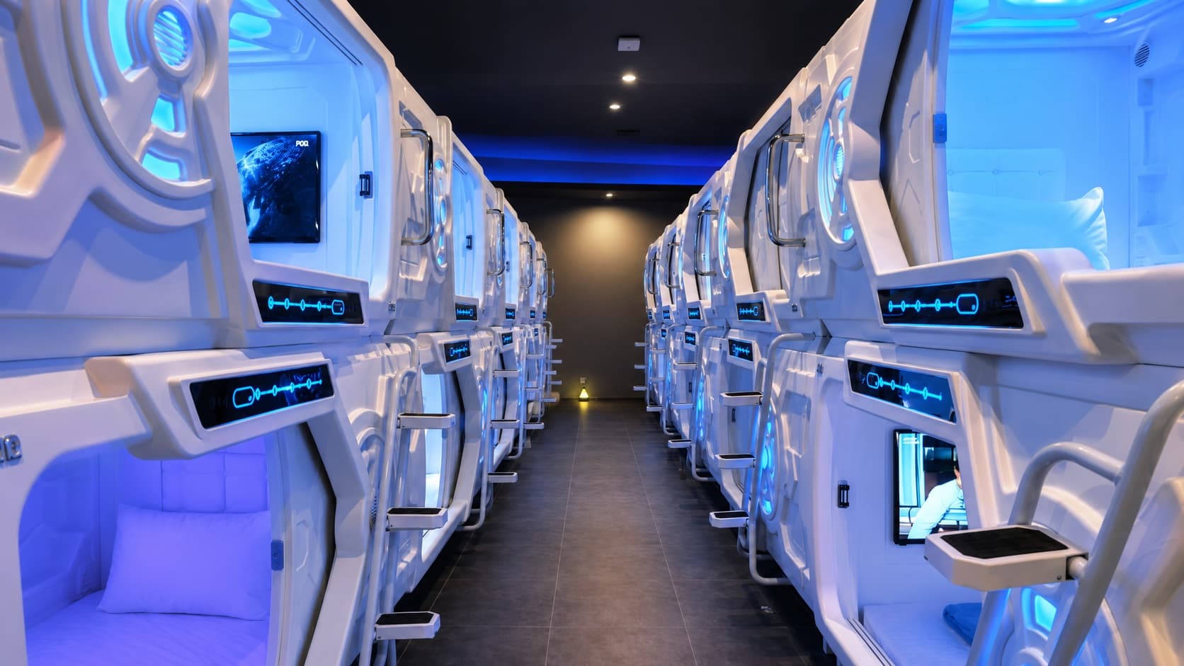 Rows of installed GEELYE capsule beds in a capsule hotel