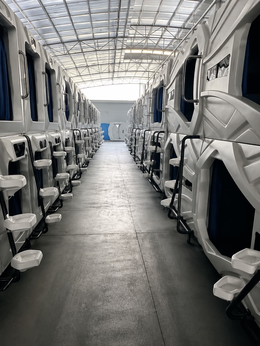 Rows of GEELYE sleep pods prepared for a large accommodation project
